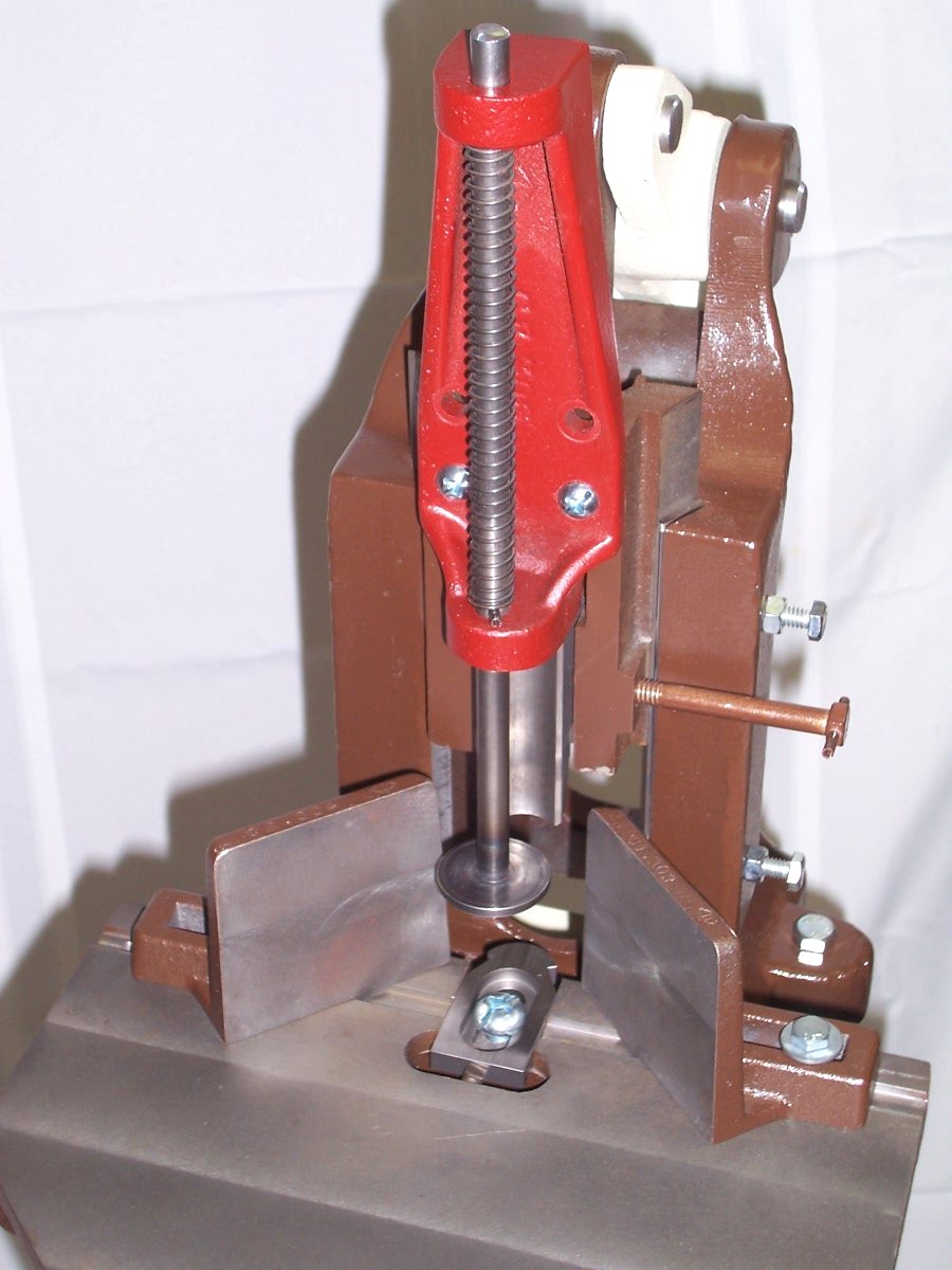 Close-up of the bench corner cutter's dyadic cutting mechanism and clamp