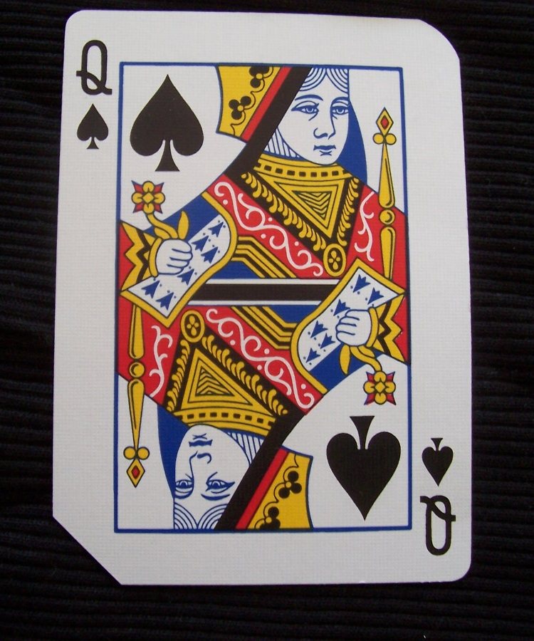 Playing card with three corners rounded and one cut straight by a Craftsmen corner cutter